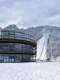 central building of Planica Nordic Center overlooking the ski jumping hills