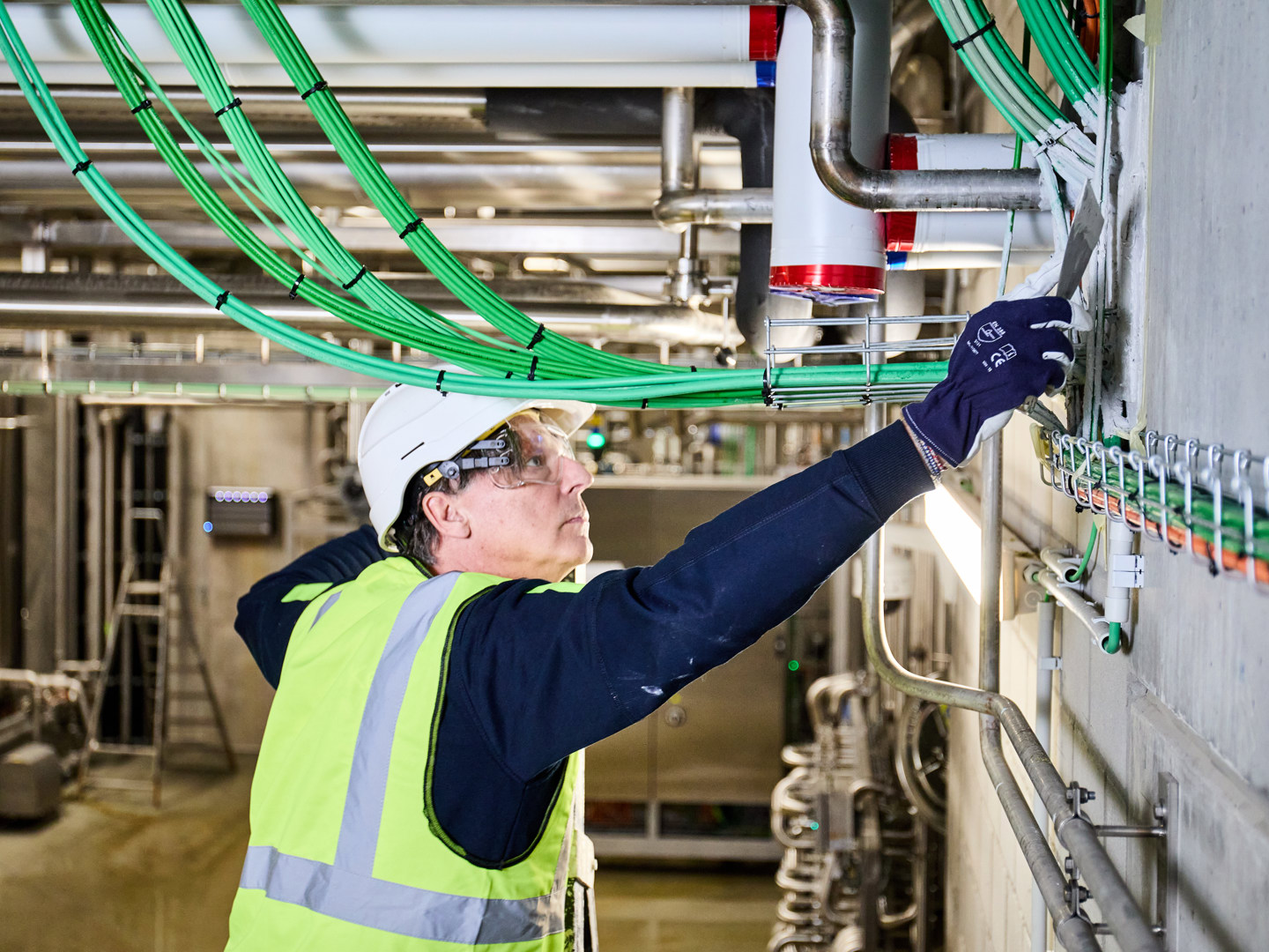 builder installing fire stopping solution