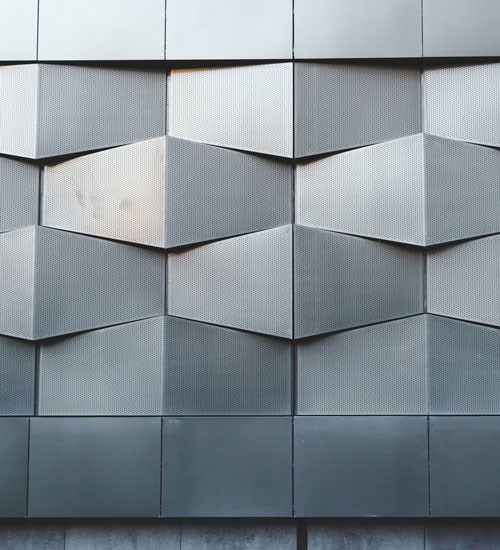 Facade made of black abstract metal architectural pattern on a new building