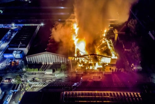 Image of a big fire in a warehouse from above