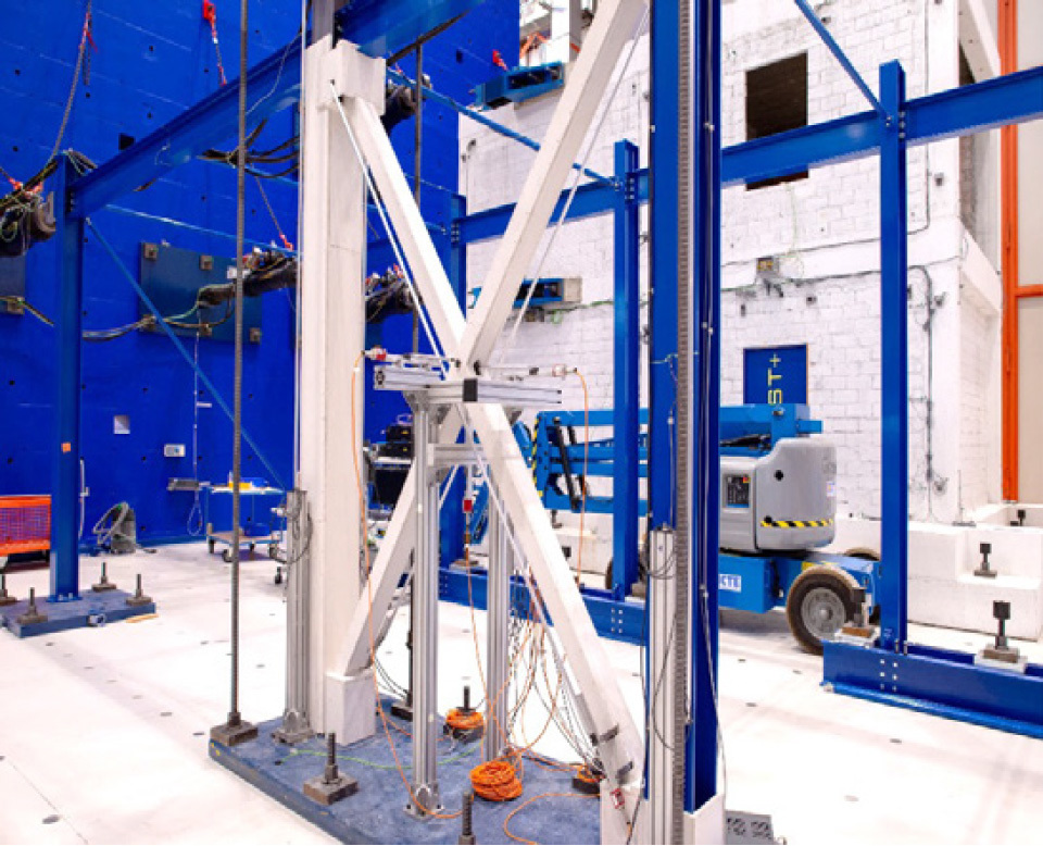 An image shows the testing of fire protection boards with and without seismic design.